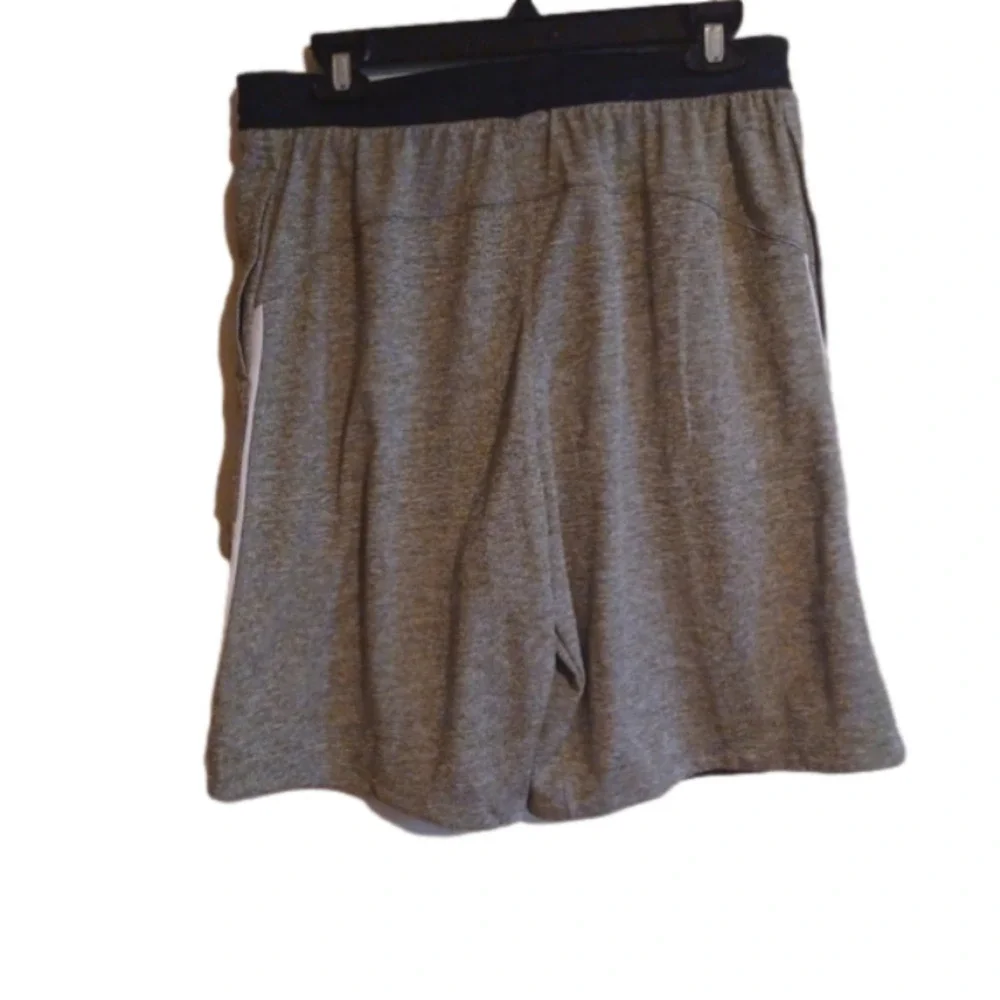 NWT   Adidas knit Grey shorts. Black waist band, white stripes. Size medium.